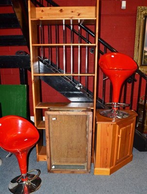 Lot 752 - A modern pine open bookcase and corner cupboard, a pine table top display case and two red...