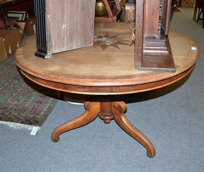 Lot 754 - A Victorian oak breakfast table, crossbanded in mahogany, inlaid with a sunburst marquetry...