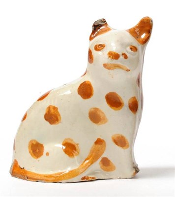 Lot 12 - A Staffordshire Creamware Model of a Seated Cat, late 18th century, press moulded, decorated...