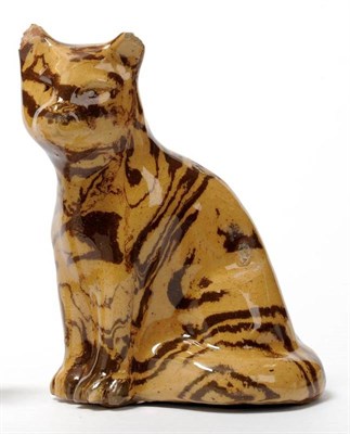 Lot 15 - A Staffordshire Agate Ware Cat, 19th century, of buff colour with brown marbling throughout, 13cm