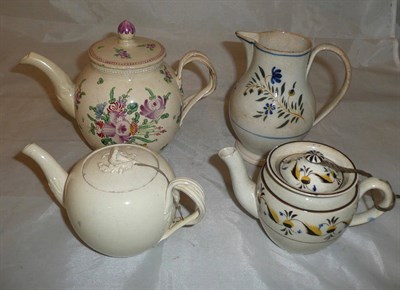 Lot 14 - A small pearlware teapot and cover and a sparrow beak milk jug; a creamware teapot and cover...