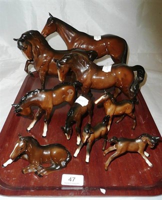 Lot 47 - Three brown Beswick horses with six foals