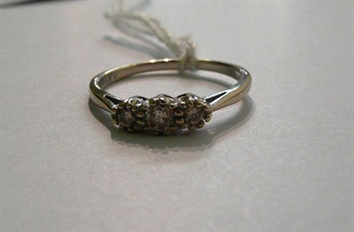 Lot 59 - An 18ct gold diamond three stone ring