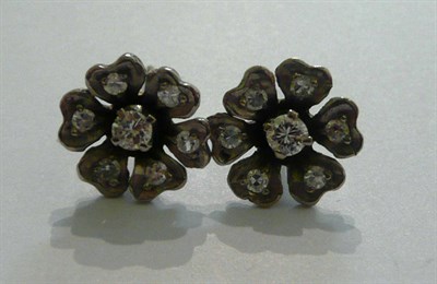 Lot 78 - A pair of diamond set floral cluster earrings