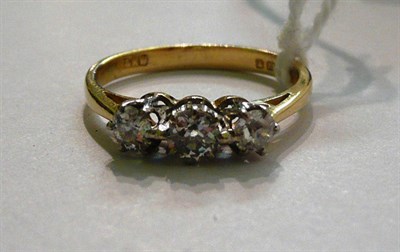 Lot 79 - An 18ct gold diamond three stone ring, the graduated old cut diamonds in white claw settings,...