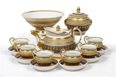 Lot 26 - A Continental Porcelain Tea Service, circa 1800, in Empire style, gilt with stylised classical...