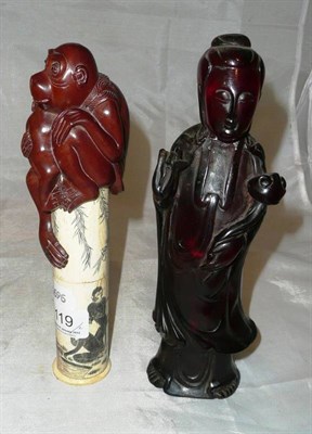 Lot 119 - A carved wood monkey group and a resin figure