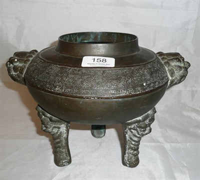 Lot 158 - A Chinese bronze tripod vessel in archaic style