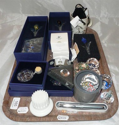 Lot 165 - A collection of assorted Swarovski Crystal including flowers, paperweights etc, boxed