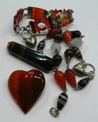 Lot 184 - A carnelian bracelet, two carnelian and agate bracelets, a heart shaped carnelian brooch and a...