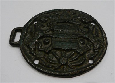 Lot 192 - A 15th century bronze oval medallion cast with a coat of arms
