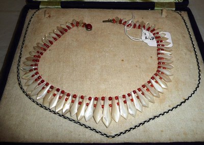 Lot 206 - Coral and mother of pearl necklace in original case