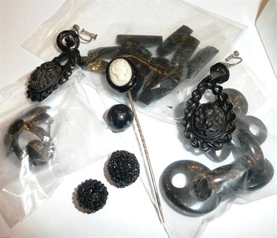 Lot 208 - A collection of loose jet brooches, necklaces etc
