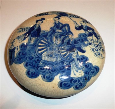 Lot 214 - A Chinese soft-paste porcelain circular box and cover, painted in blue with maidens around a...