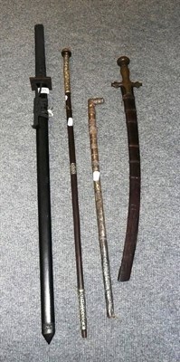 Lot 221 - A Japanese sword, an Indian Tulwar and two swordsticks