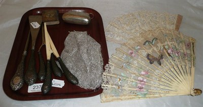 Lot 237 - A silver purse, a small silver backed book, silver handled button hook, curling tongs, glove...