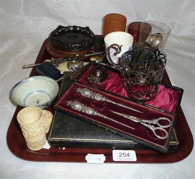 Lot 254 - A tray of collectors items including a silver teaspoon, skirt lifter, Chinese bowl etc
