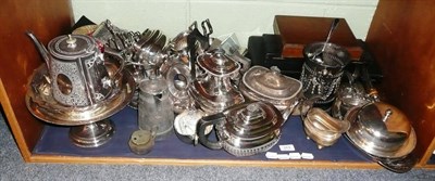 Lot 313 - A shelf of plated items including an Art Nouveau dish, teapots, flat ware etc