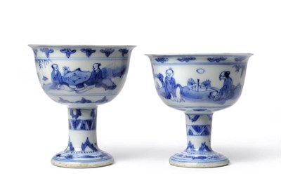 Lot 50 - A Near Pair of Chinese Porcelain Stem Cups, mid 17th century, painted in underglaze blue with...