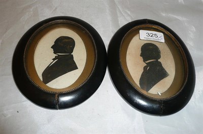 Lot 325 - A pair of silhouettes with gilt highlighting