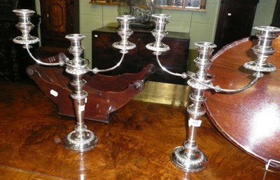 Lot 350 - A pair of silver plated two branch, three light candelabra