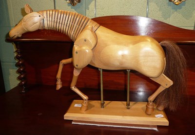 Lot 357 - A wooden artist's model of a horse