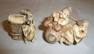 Lot 369 - A carved ivory netsuke of two men and another, circa 1930