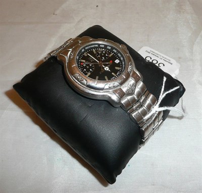 Lot 385 - A stainless steel quartz wristwatch signed Tag Heuer, McLaren and outer Tag Heuer case