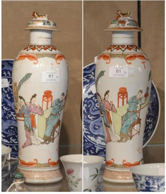 Lot 61 - A Pair of Chinese Porcelain Vases and Covers, late 18th/19th century, of slender baluster form, the