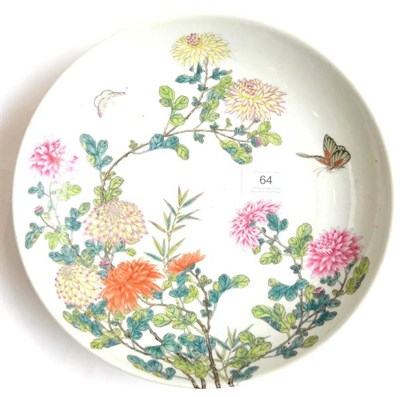 Lot 64 - A Chinese Porcelain Saucer Dish, 20th century, painted in famille rose enamels with butterflies...