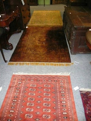 Lot 470 - Pakistani Bokhara rug with rust field and columns of quartered guls together with two other...