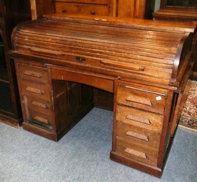 Lot 483 - An oak roll-top desk