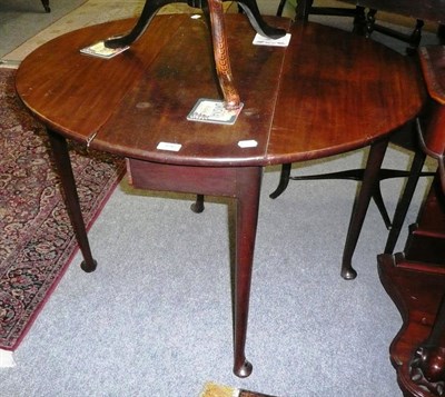 Lot 496 - A George III mahogany pad foot table