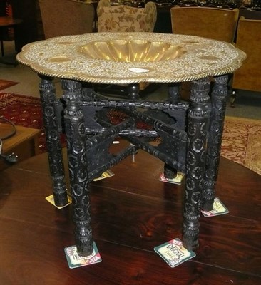 Lot 497 - An Indian brass-top table