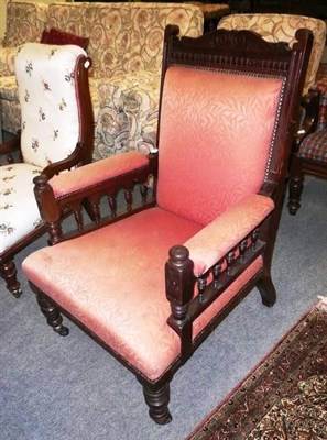 Lot 538 - A late Victorian walnut-framed open armchair