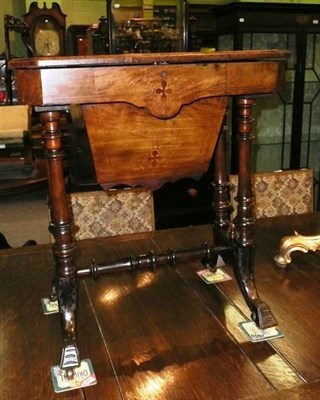 Lot 545 - Victorian walnut sewing table