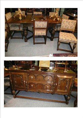 Lot 546 - 17th century style dining room suite comprising an extending table, eight chairs and a sideboard