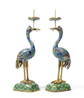 Lot 72 - A Pair of Chinese Cloisonné Candlesticks, Qing Dynasty, 19th century, modelled as standing cranes