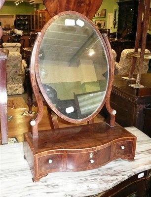 Lot 554 - A Georgian mahogany toilet mirror with Serpentine-front plateau