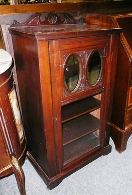 Lot 556 - * Edwardian walnut music cabinet