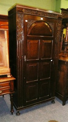 Lot 578 - * A carved oak hall wardrobe