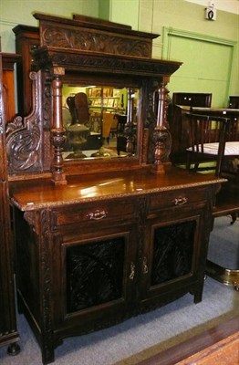 Lot 579 - Carved oak mirror back sideboard