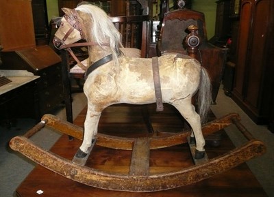 Lot 581 - A 19th century rocking horse, the horse skin stuffed with straw