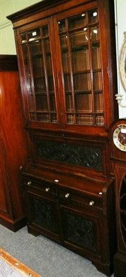 Lot 592 - Late Victorian carved walnut secretaire bookcase