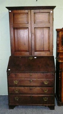 Lot 596 - An 18th century oak bureau bookcase (made up)