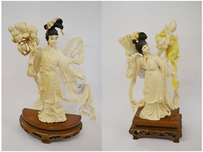 Lot 79 - A Chinese Carved Elephant Ivory Figure of a Maiden, circa 1962, holding a magnolia spray, with...