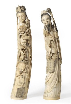 Lot 80 - A Pair of Chinese Ivory Figures, early 20th century, of a sage standing holding a staff and a...