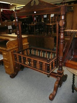 Lot 639 - Indian carved rosewood cradle in swing stand