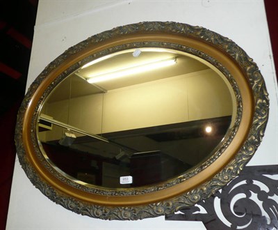 Lot 653 - * An oval gilt framed mirror