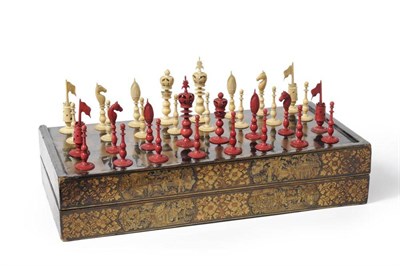 Lot 83 - A Chinese Red Stained and Natural Ivory  "Burmese " Pattern Chess Set, 19th century, the kings...